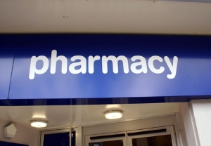 Blue-pharmacy-banner-hanging-in-store-window